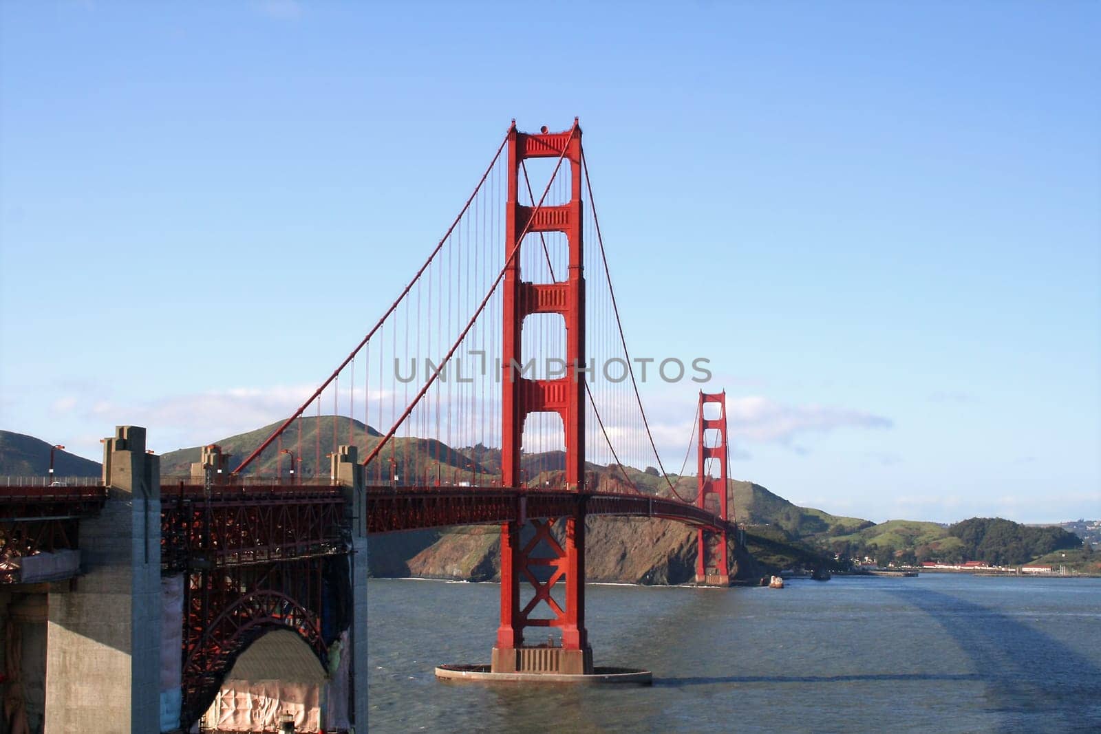 Golden Gate Bridge in front of blue sky in landscape mode