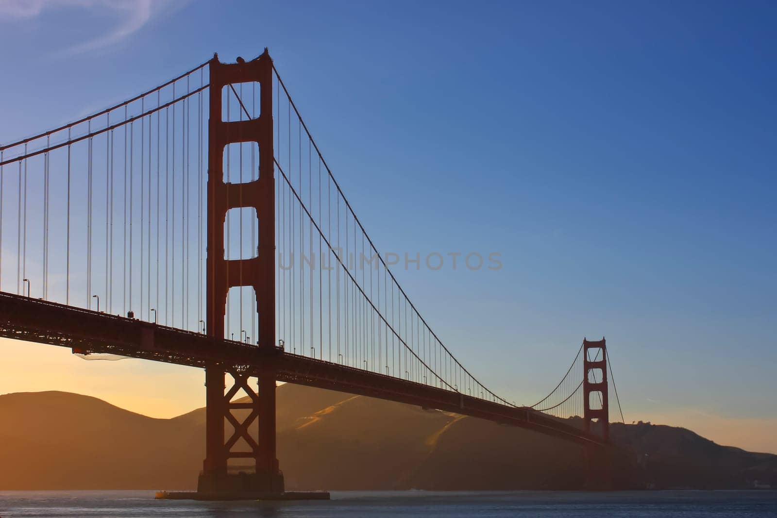 Golden Gate Bridge in the evening in light fog