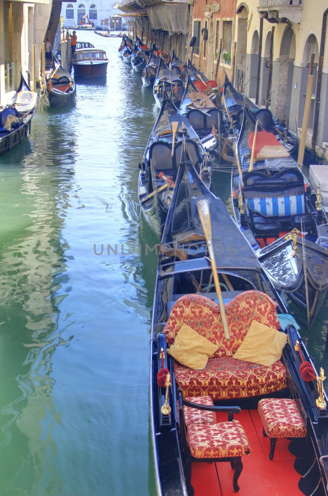 romantic canal in Venice with gondolas
