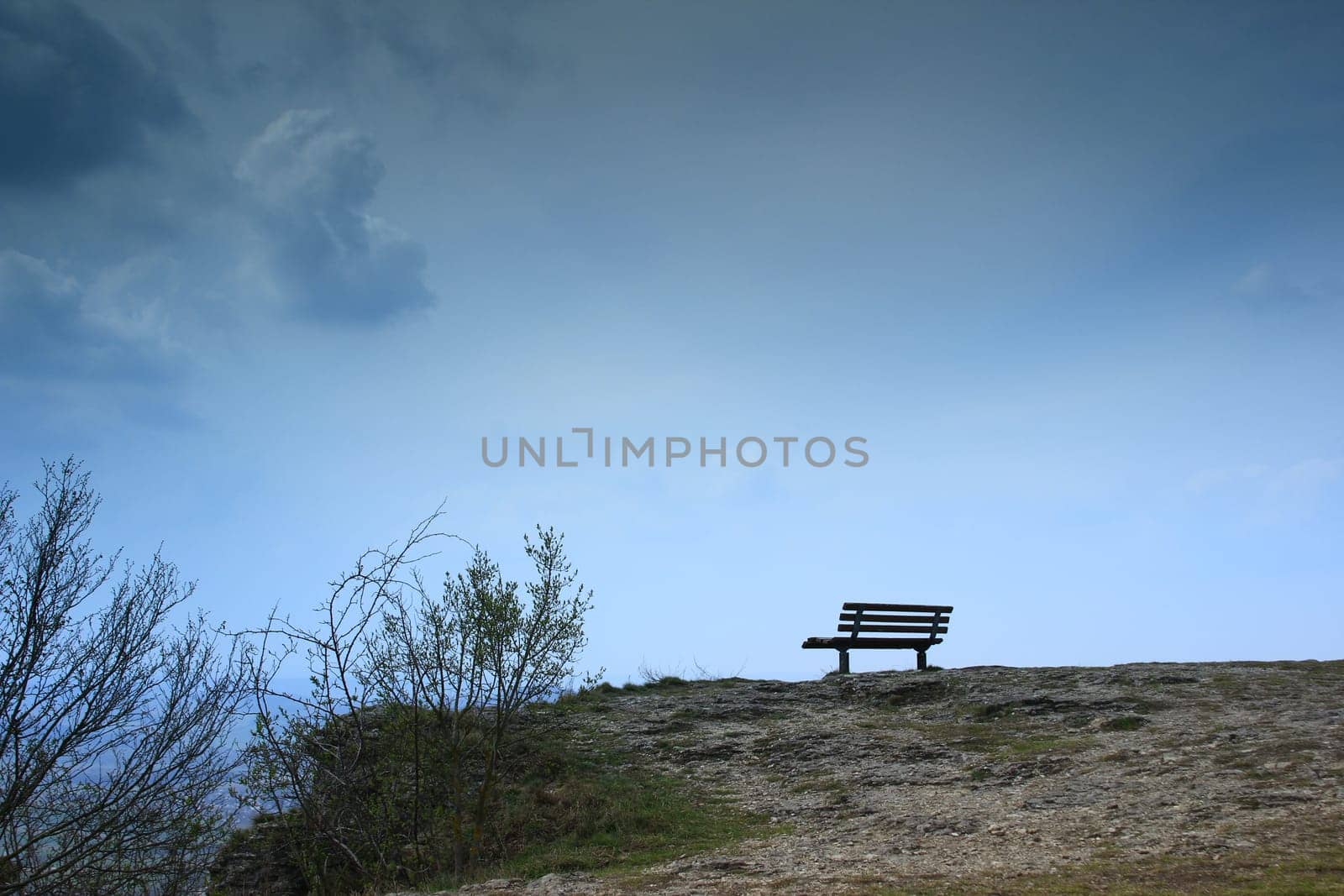 lonely bench on a rocky outcrop
