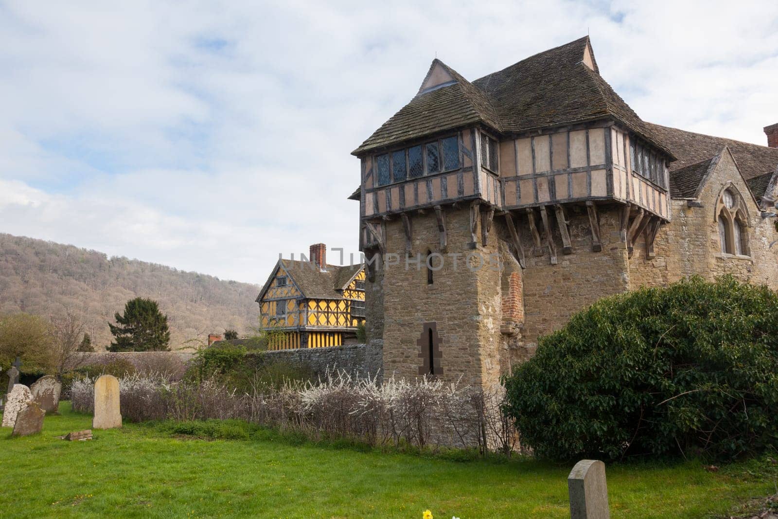 Stokesay castle on a cloudy day from cemetery