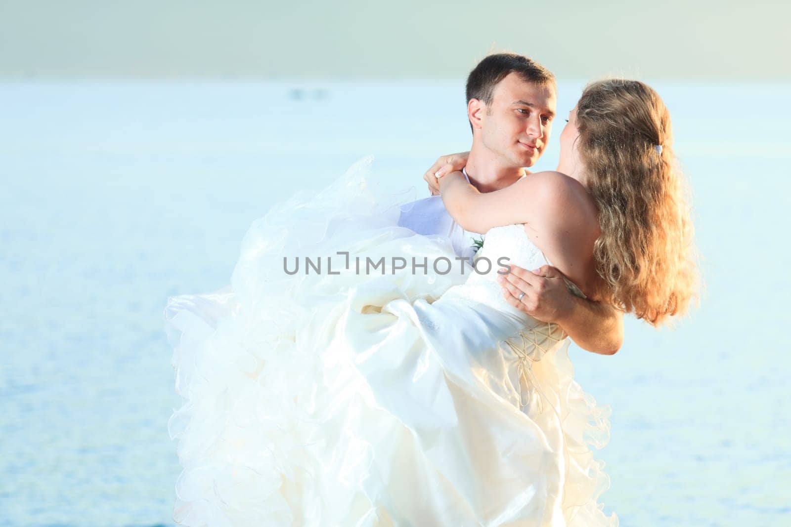 Bride and groom on the beach. Tropical wedding