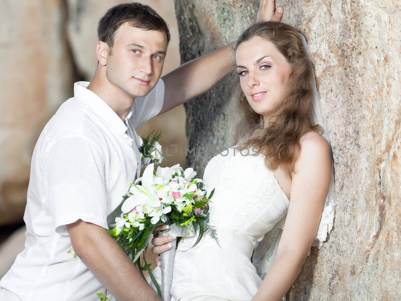 Bride and groom on the beach. Tropical wedding