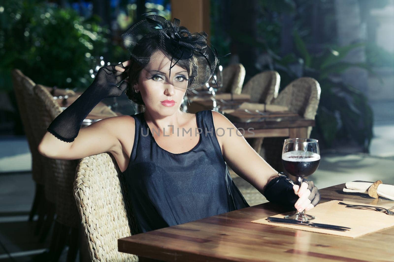 Fashion woman retro portrait in a restaurant