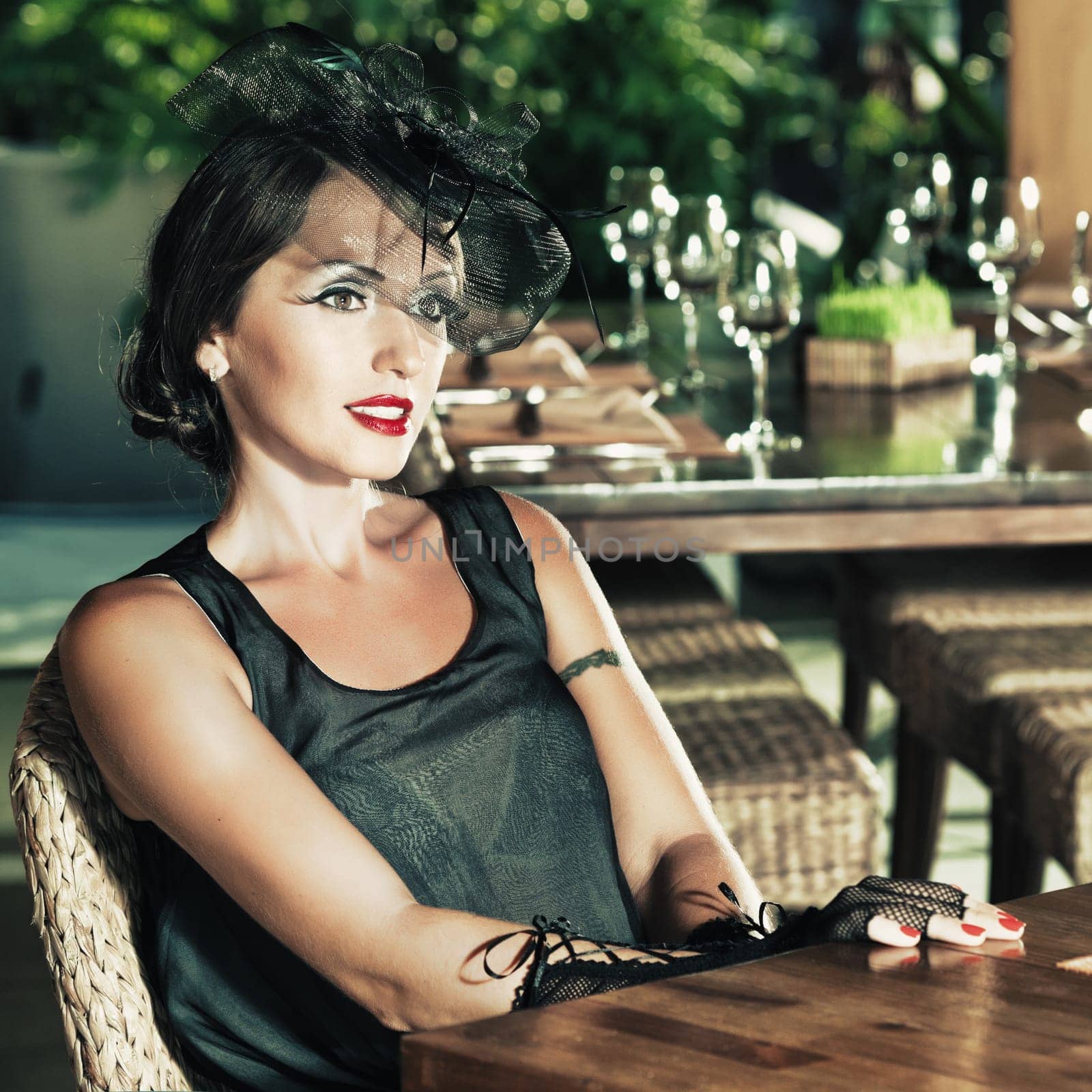 Fashion woman retro portrait in a restaurant