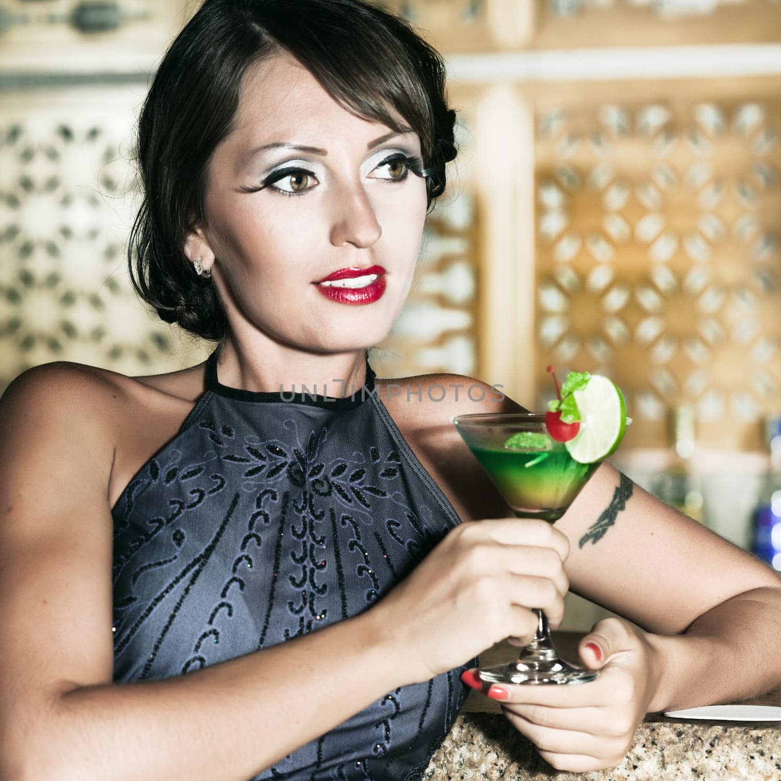 Fashion woman retro portrait with a cocktail