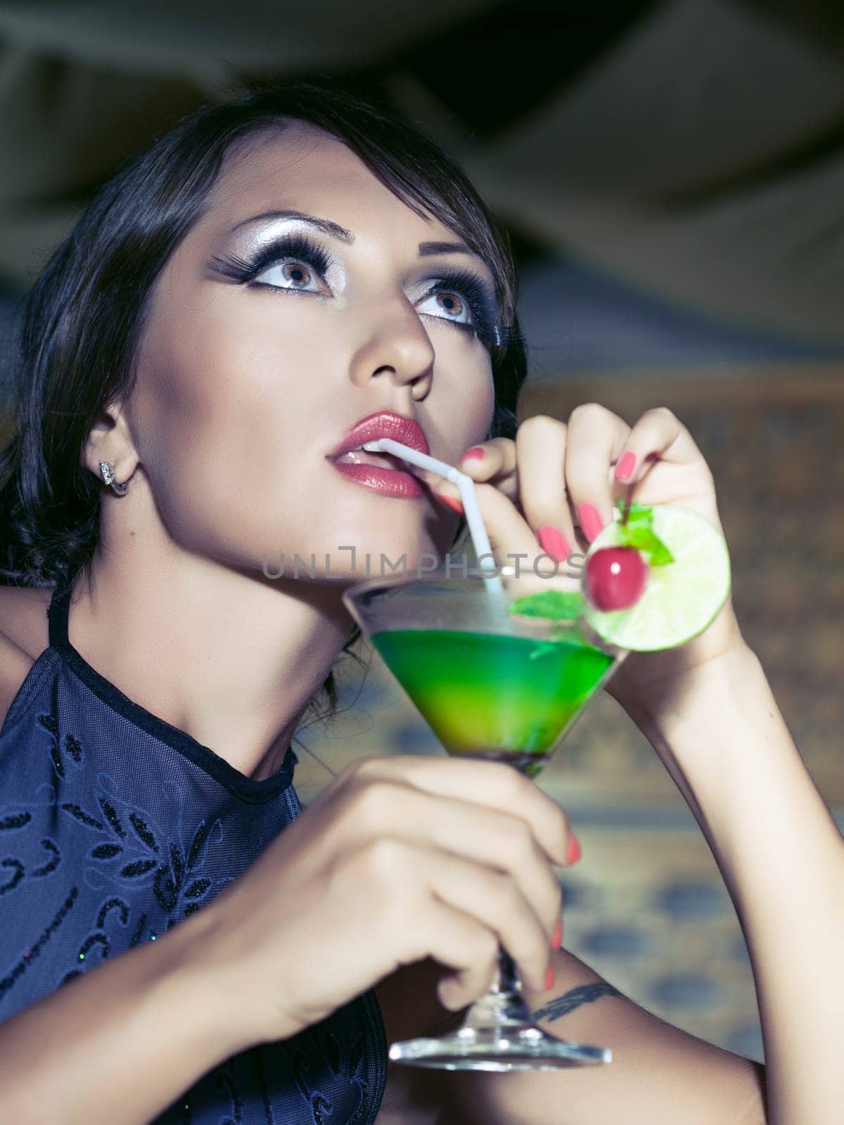Fashion woman retro portrait with a cocktail