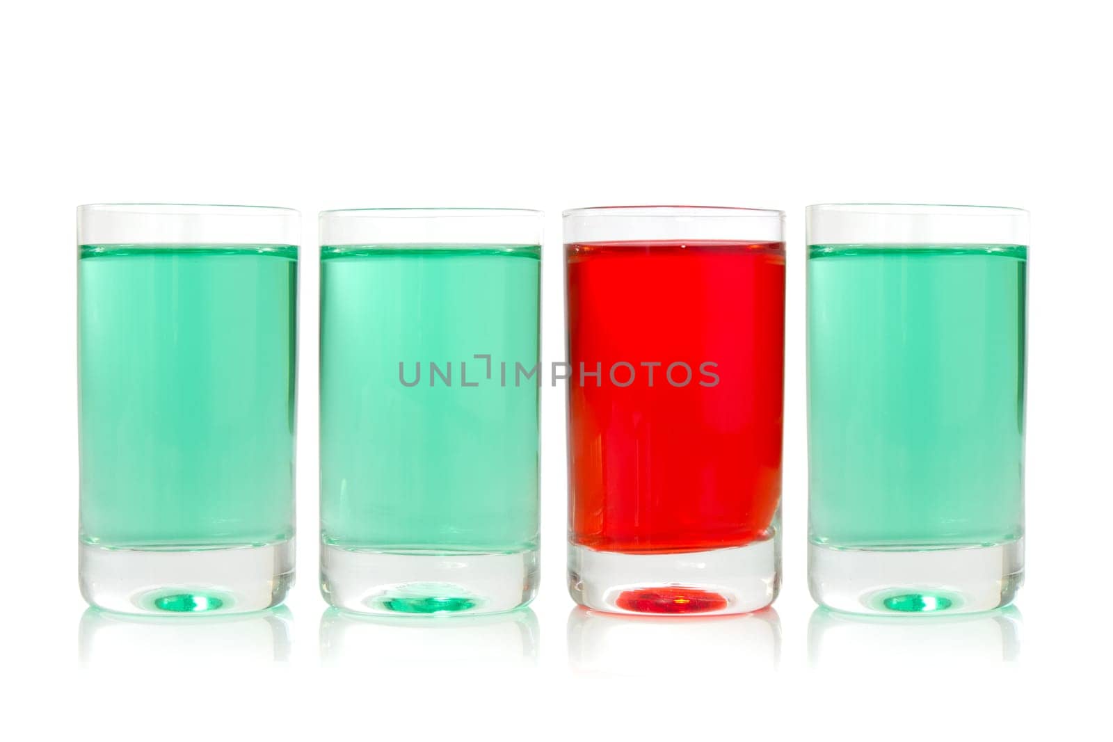 row of glasses with green and red liquid