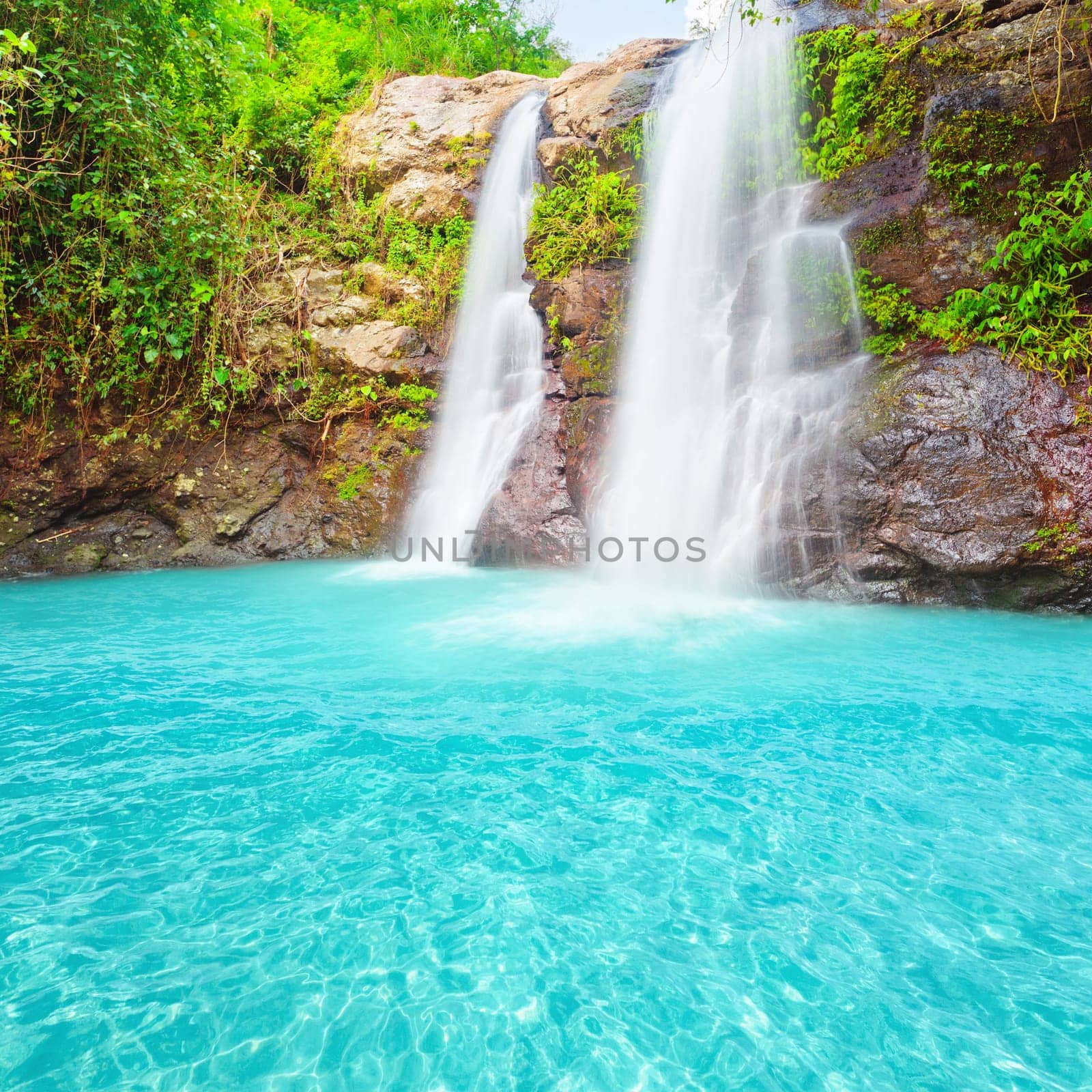 Beautiful waterfall at summer sunny day.