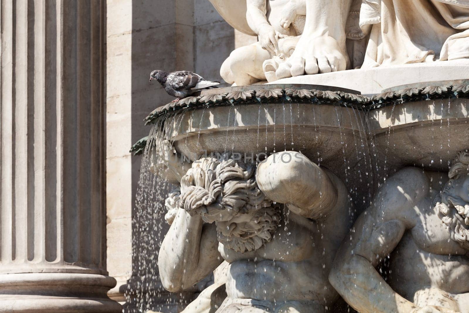 Statue in front of the Albertina,Vienna,with fountain in the inner city