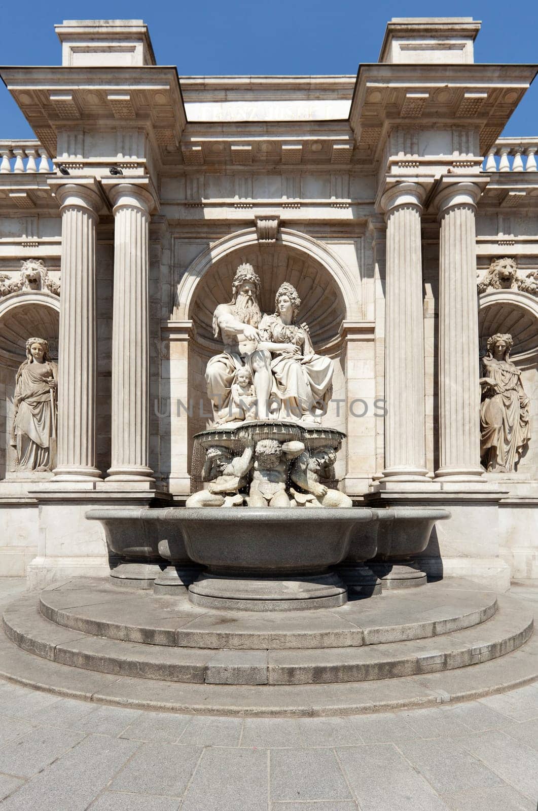 Statue in front of the Albertina,Vienna,with fountain in the inner city