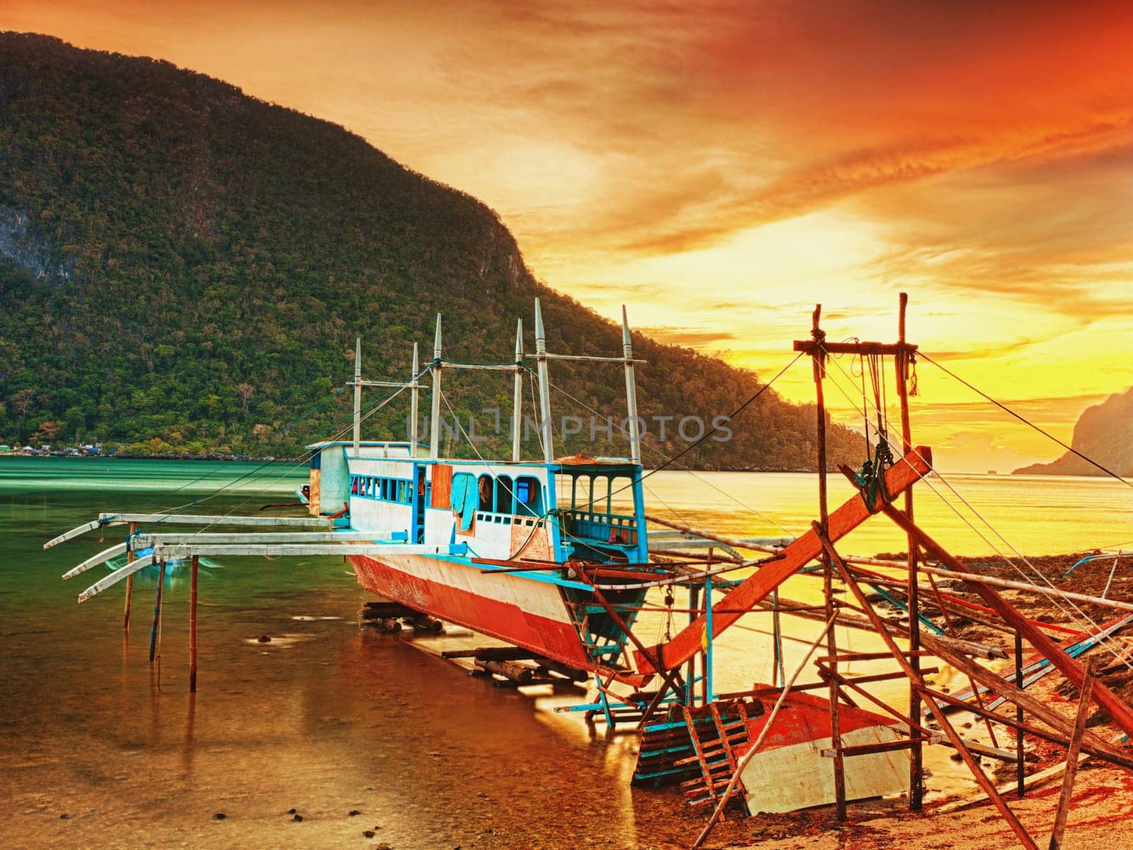 Boat in dock at sunset time. El Nido. Palawan