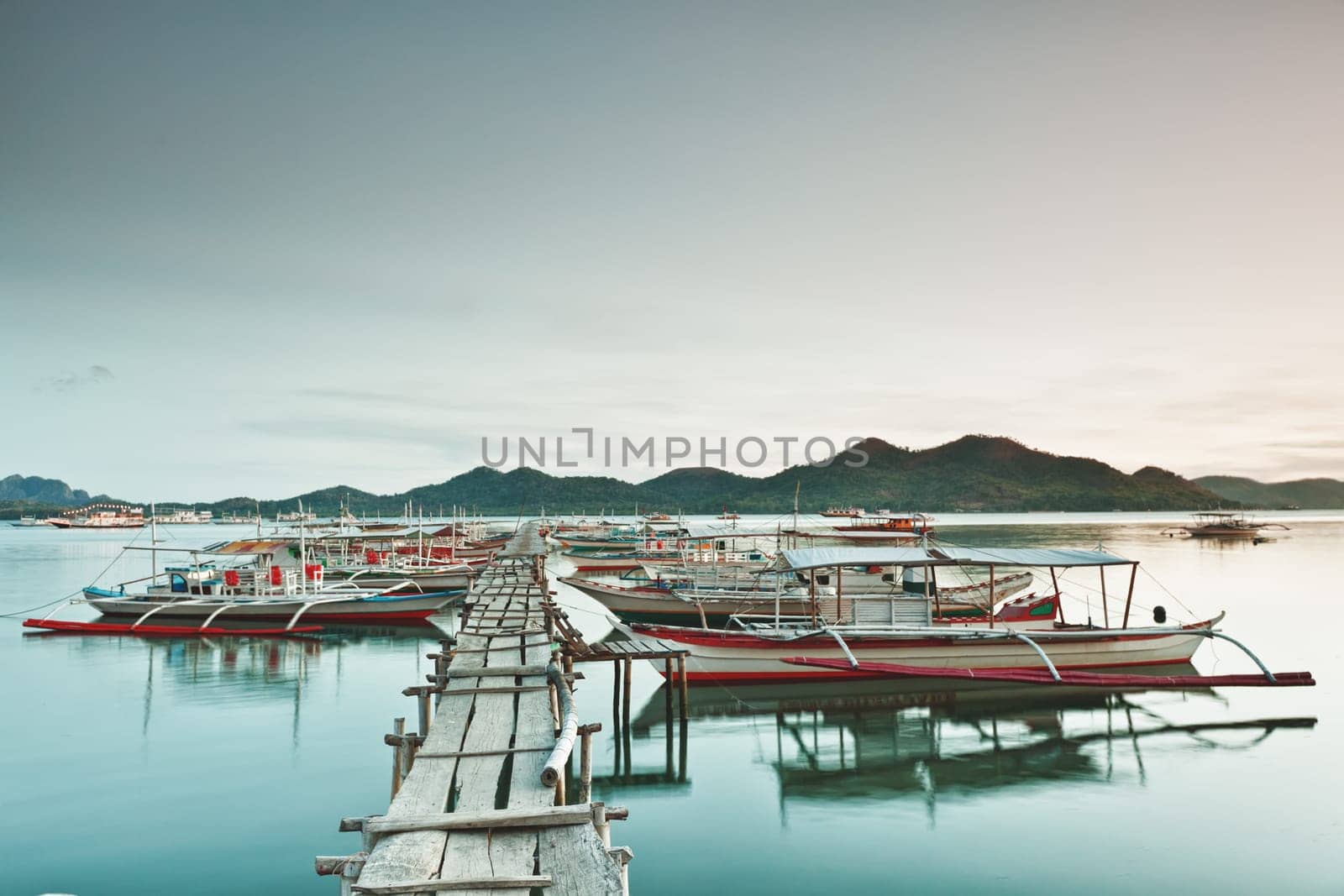 Wooden pier and bahgka boats in Coron