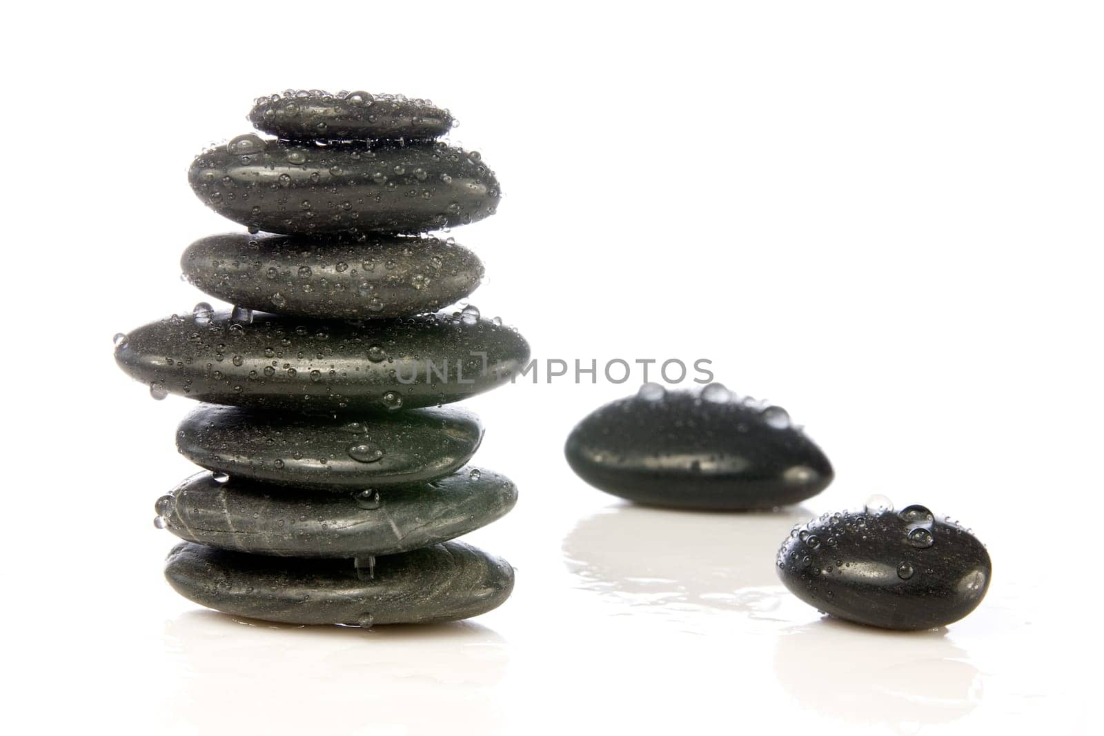 wet zen stones isolated over a white background.