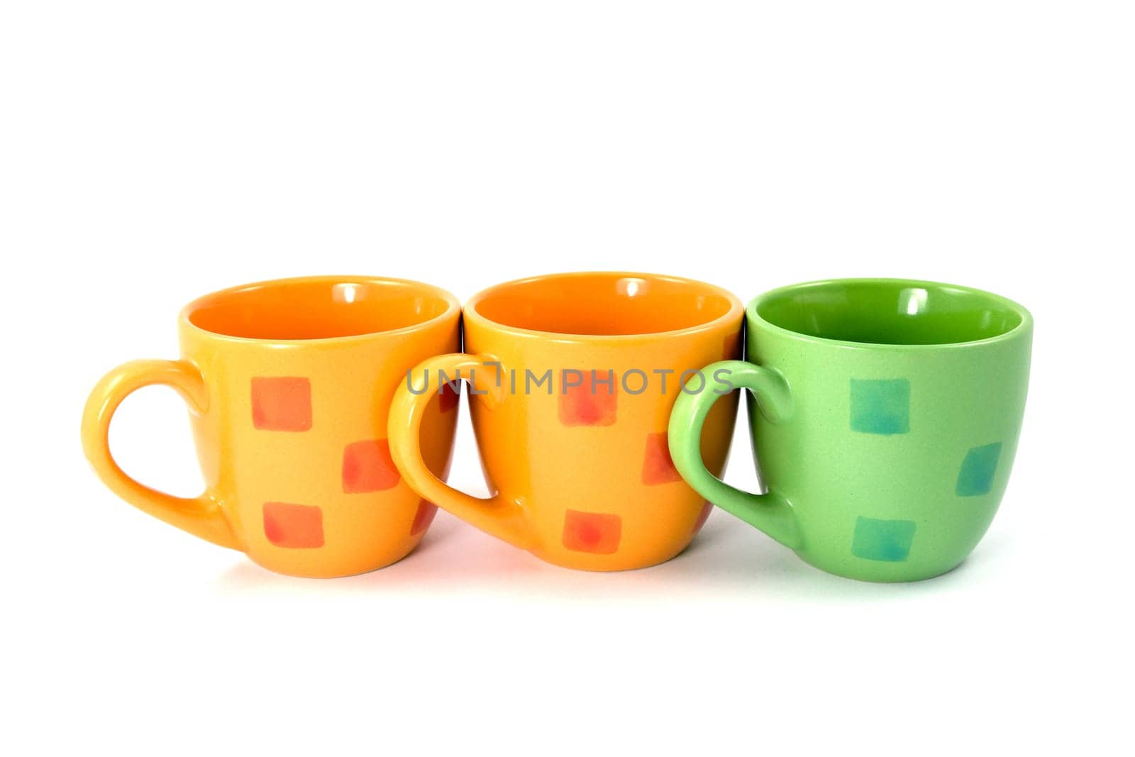 three colorful coffee cups on a white background