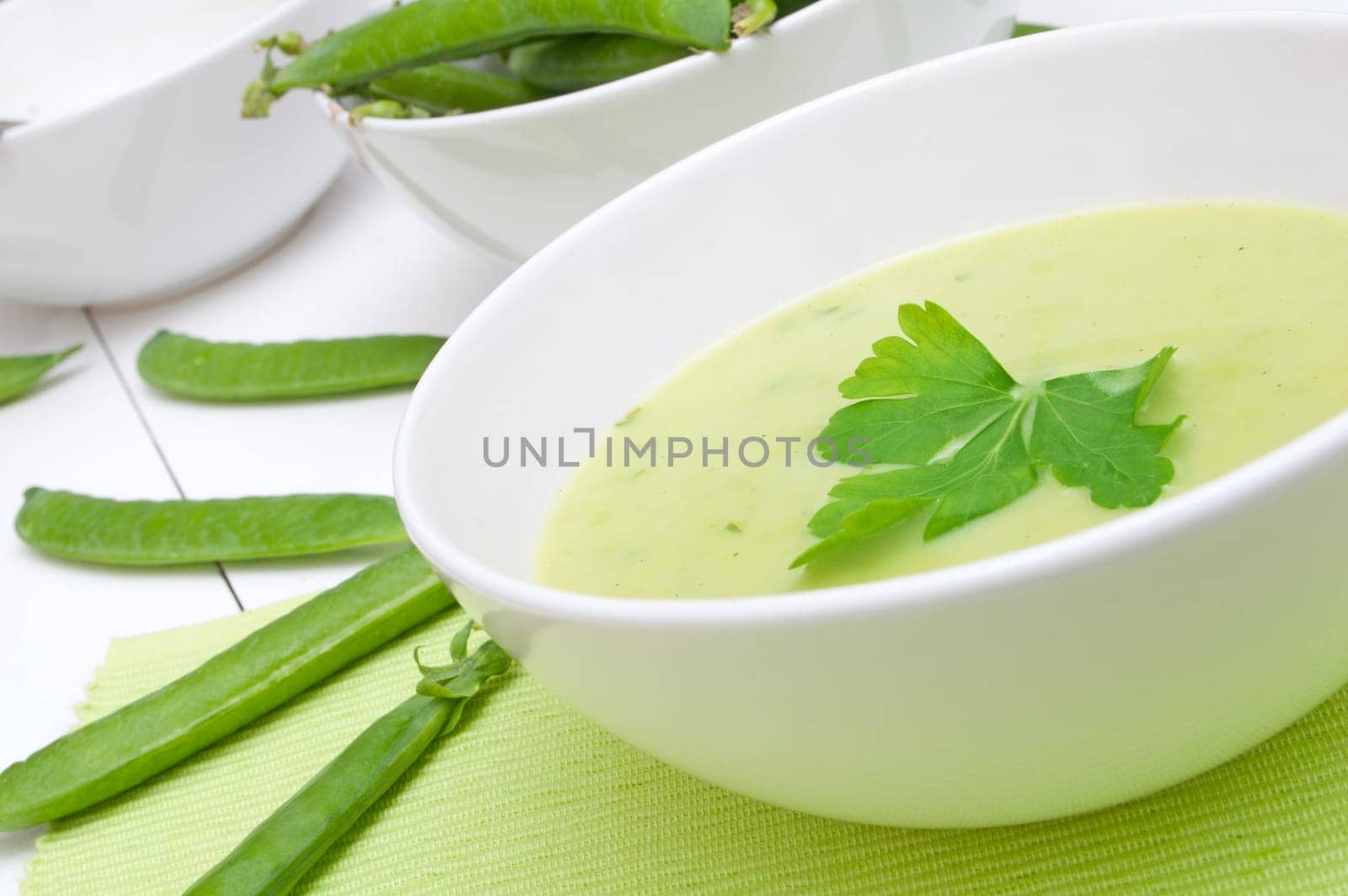 Green Creamy Pea Soup in White Bowl