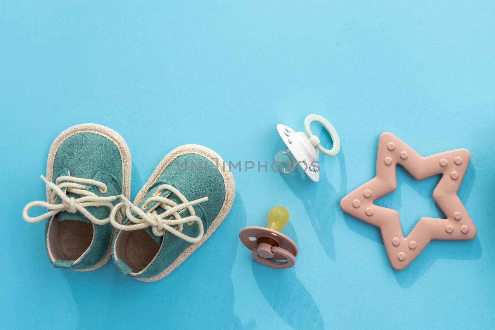 Immersing in the world of infant care, this top view flat lay captures the integral items that