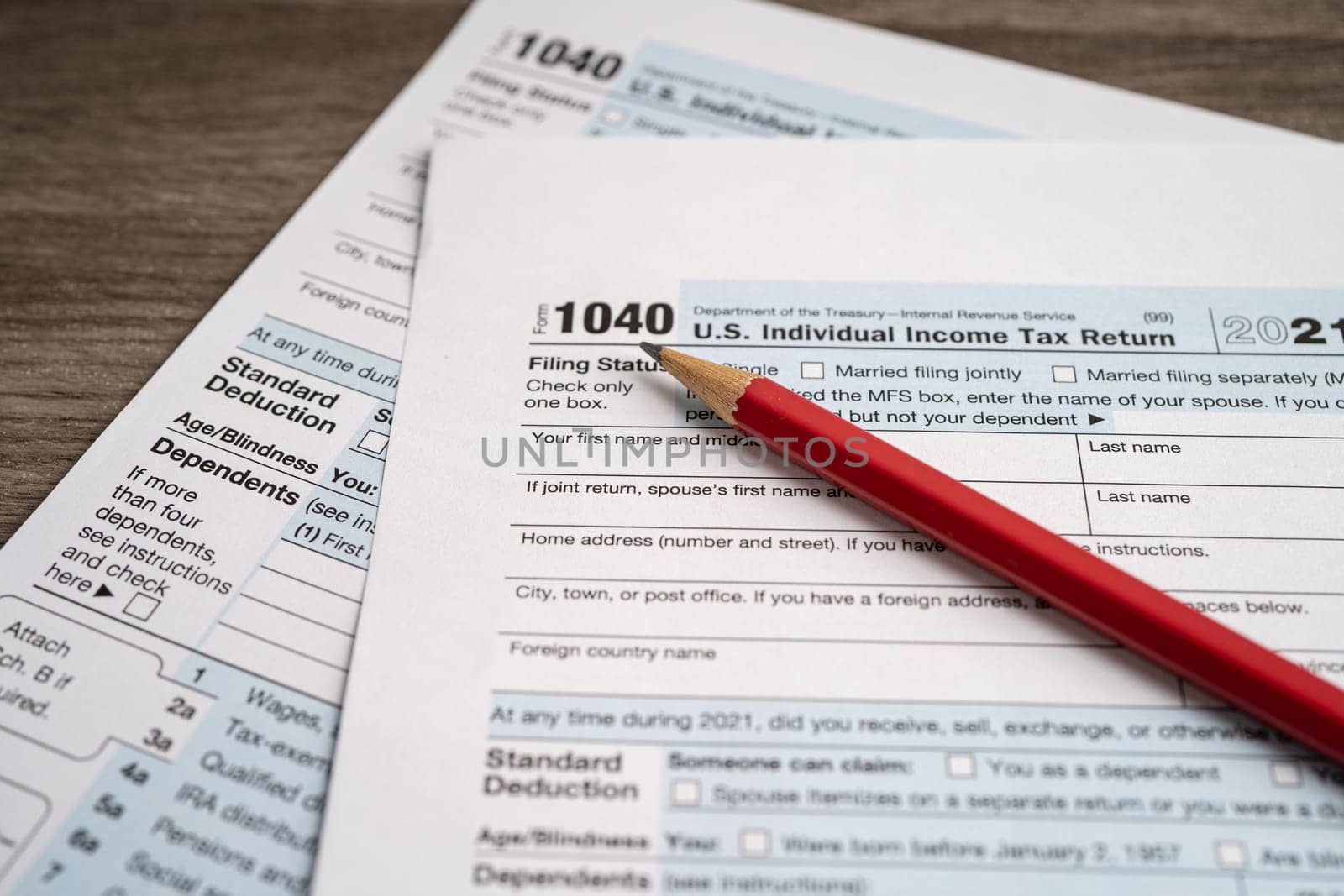 Tax Return form 1040 with pencil, U.S. Individual Income. by pamai