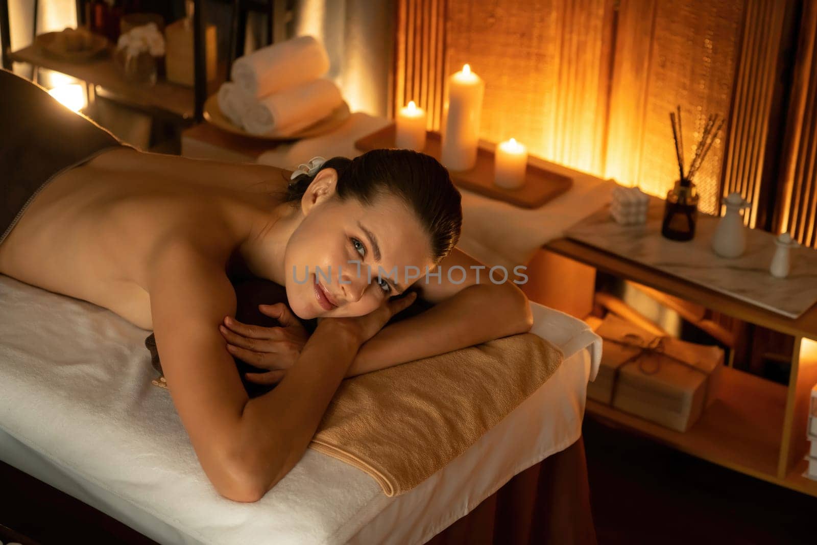 Caucasian woman customer enjoying relaxing anti-stress massage. Quiescent by biancoblue