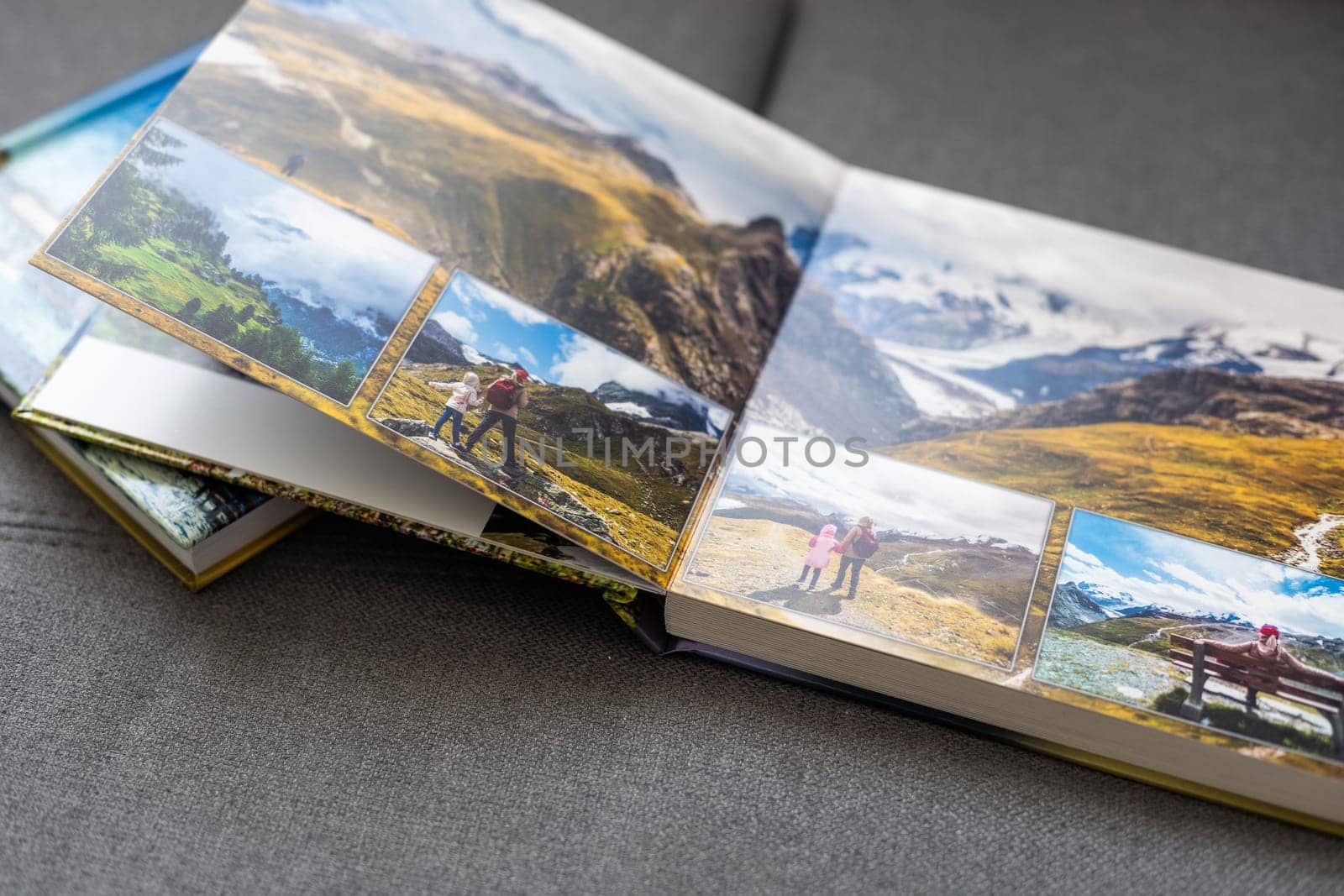 Family photos archive saved in brightly designed photo book; bright summer memories placed in the photobook. High quality photo