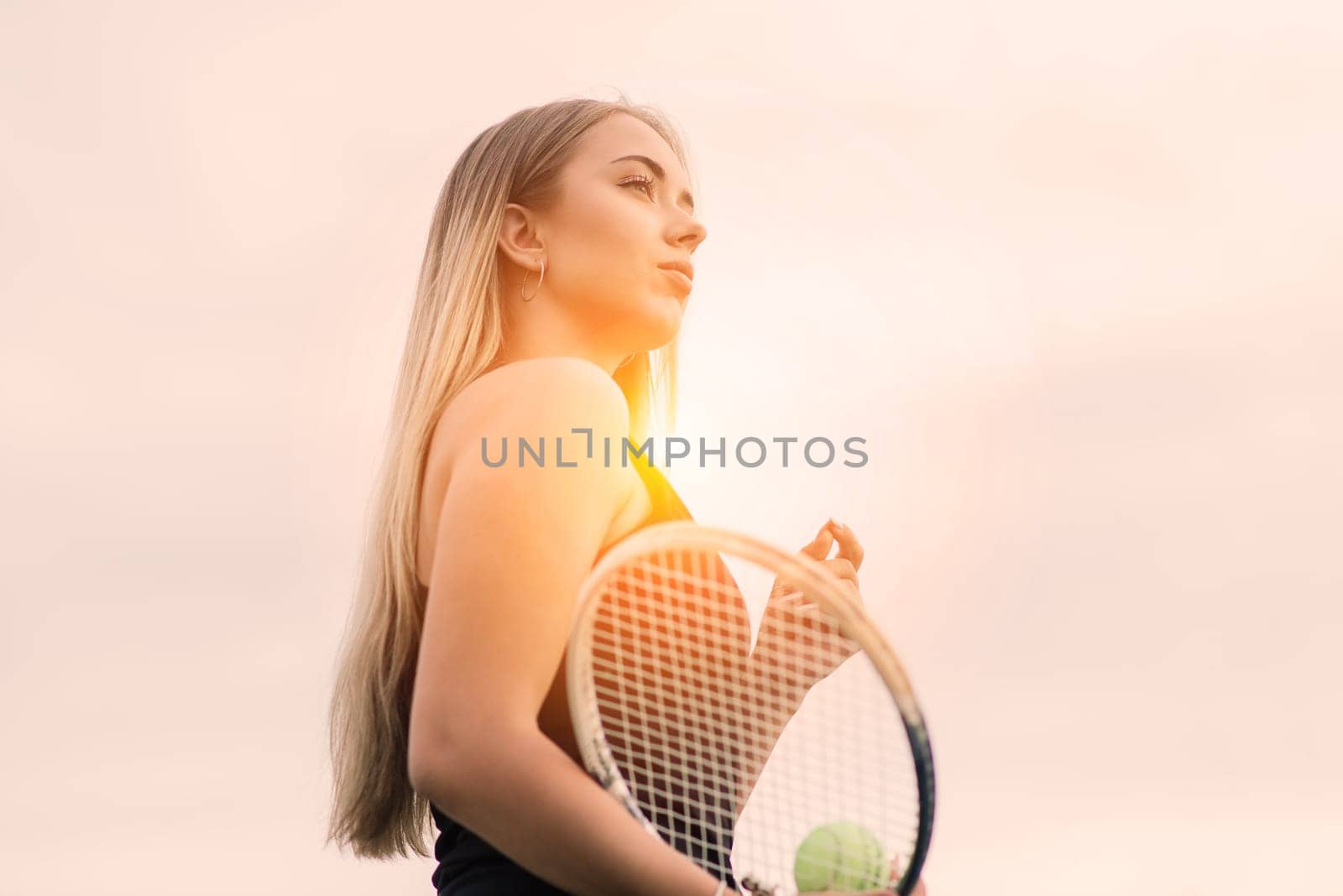 Tennis tournament. Female player at clay tennis court