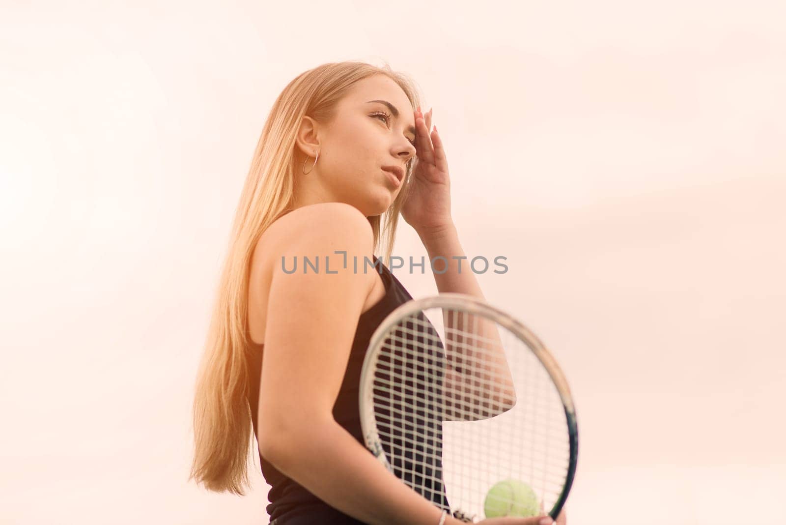 Tennis tournament. Female player at clay tennis court