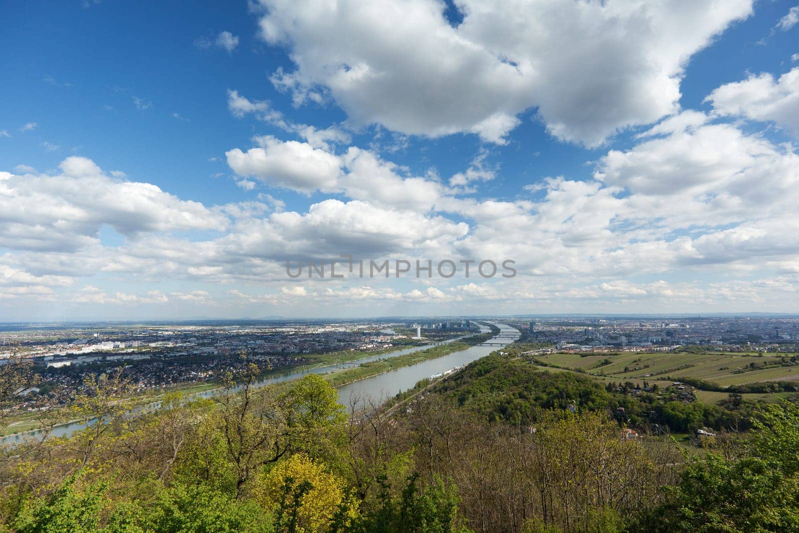 Vienna,panorama with Danube,with cumulus clouds in daylight