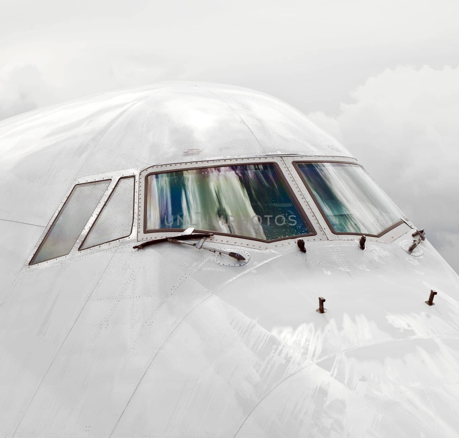 detail of aircraft nose with cockpit window