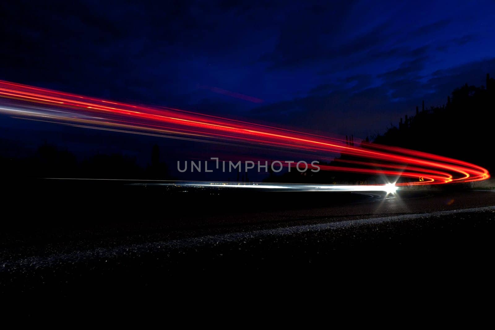 car light on interstate in mountain desert  landscape in Arizona