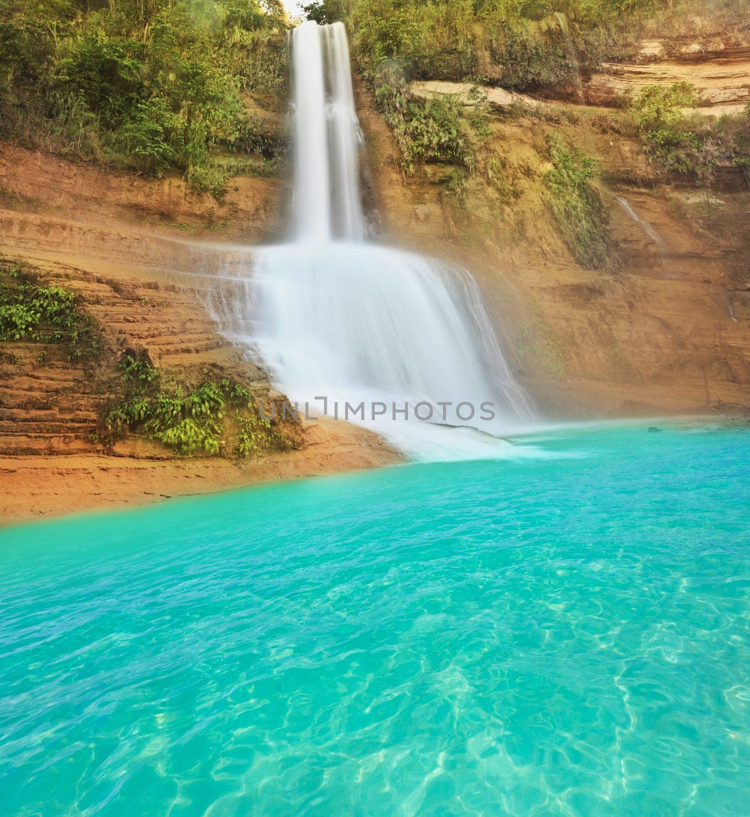 Beautiful waterfall at summer sunny day. Philippines