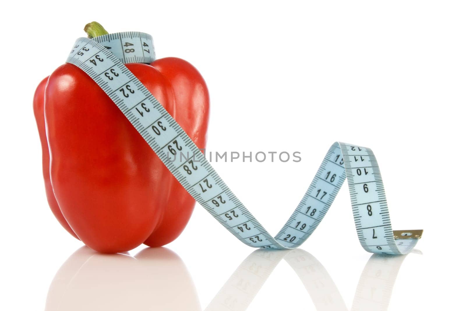 sweet pepper with a blue measuring tape