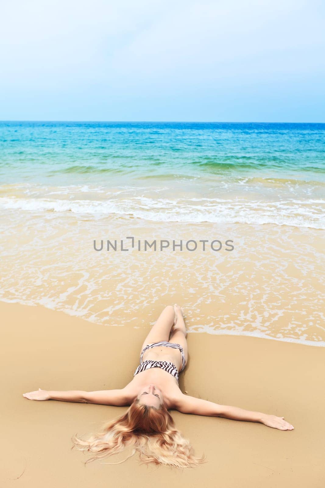 Beautiful woman in bikini on the beach