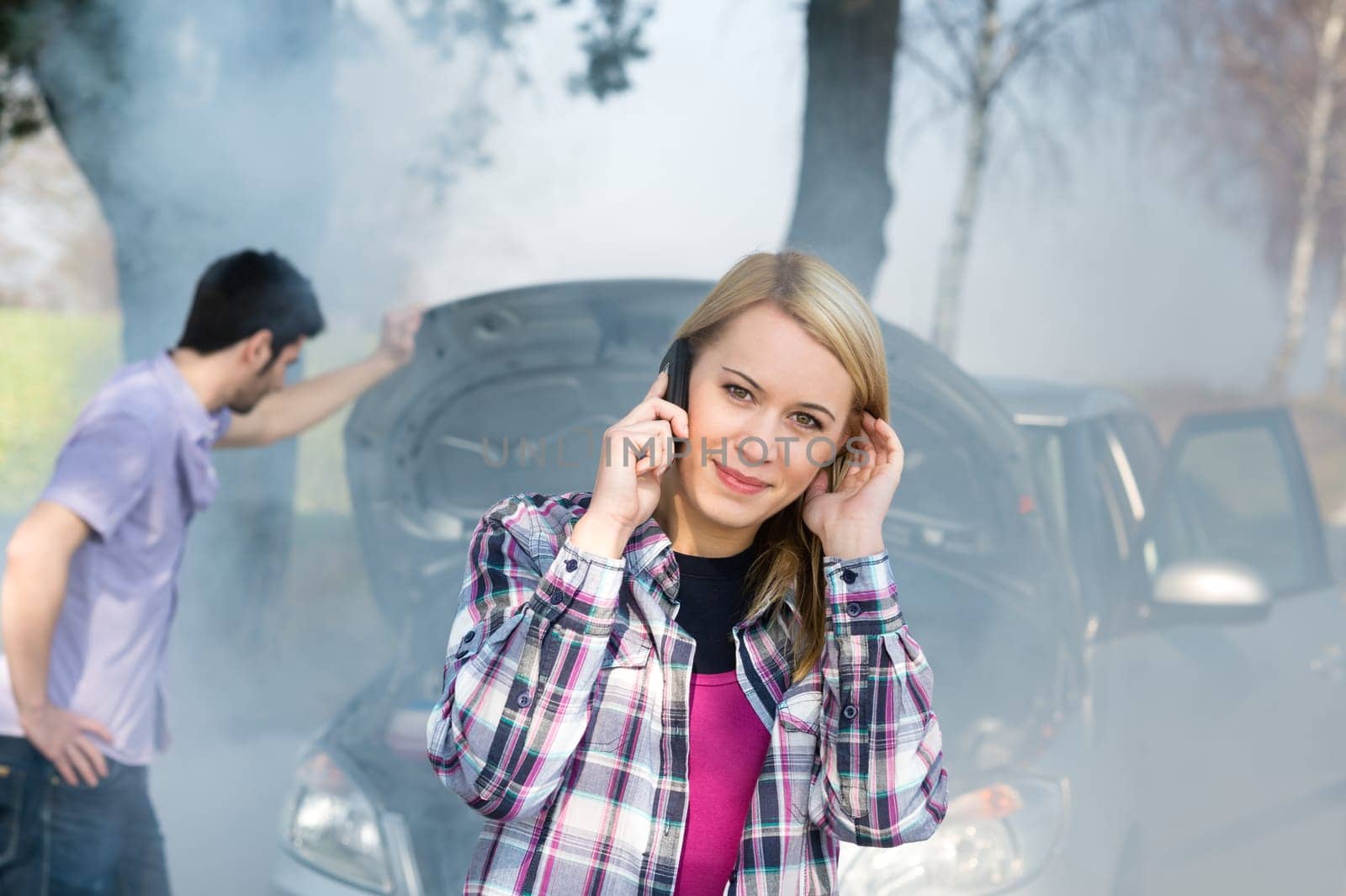 Car breakdown woman call for help road assistance smoking engine