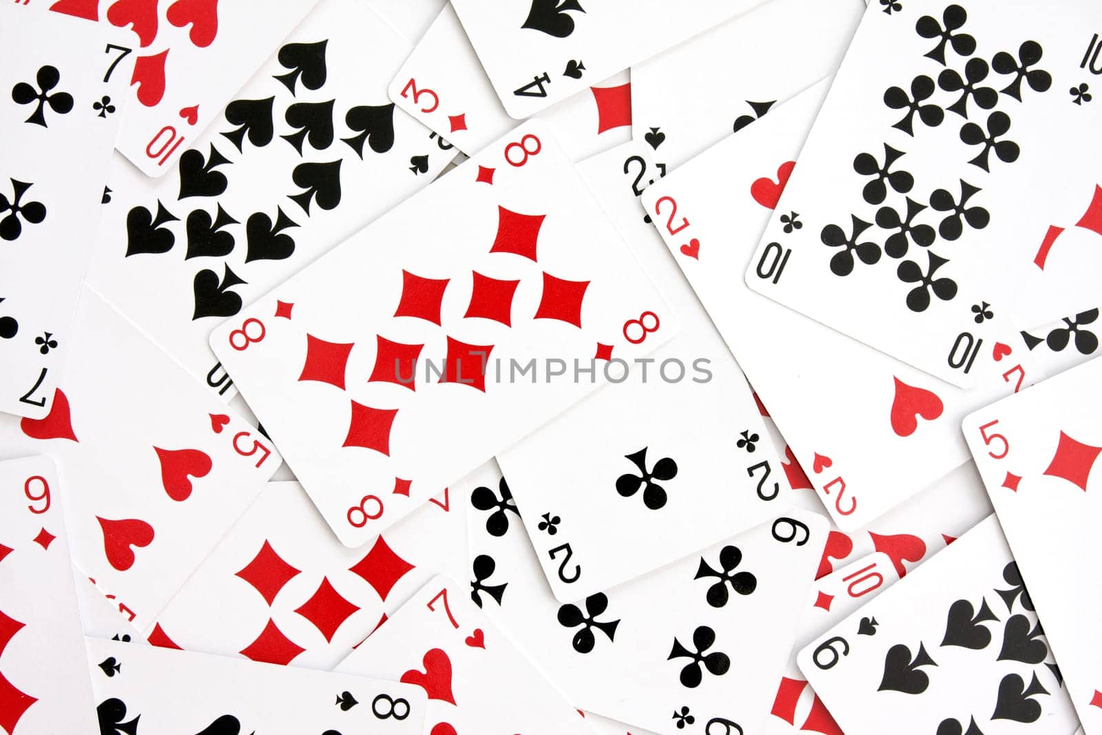 background made with playing cards randomly displaced