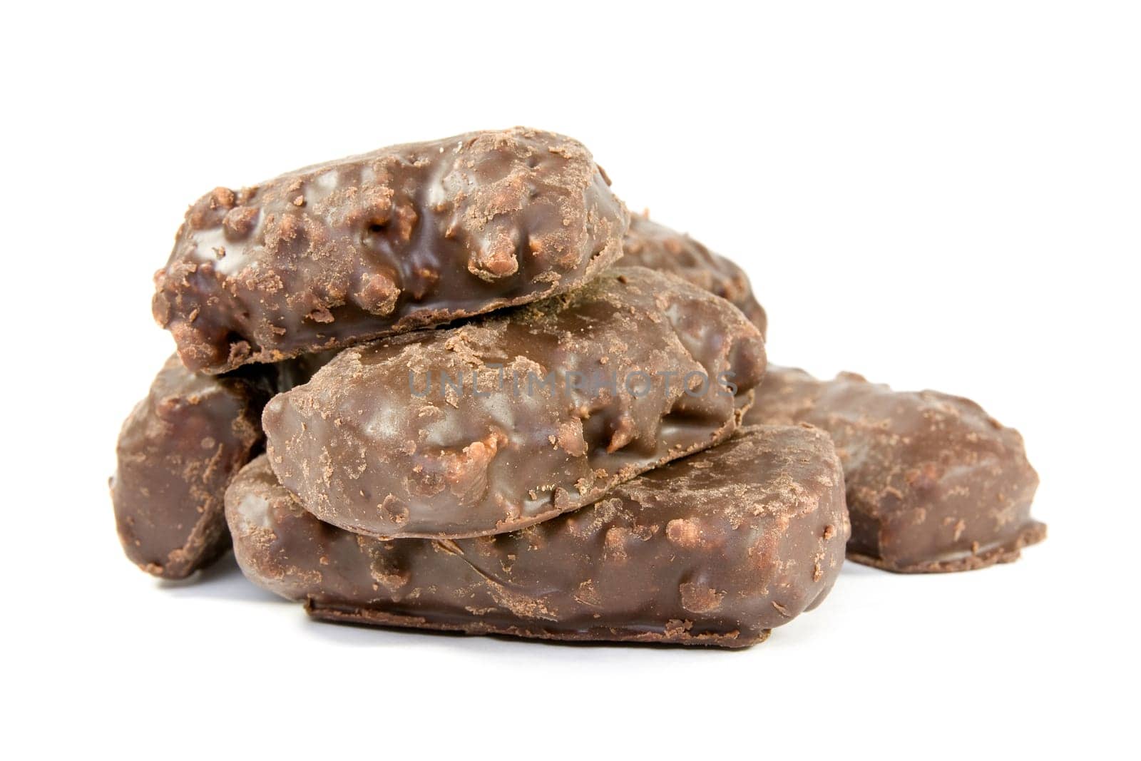 pile of chocolate sweets over a white background