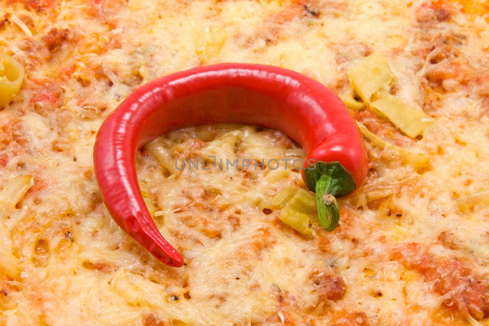 Close up of pizza with red chili pepper