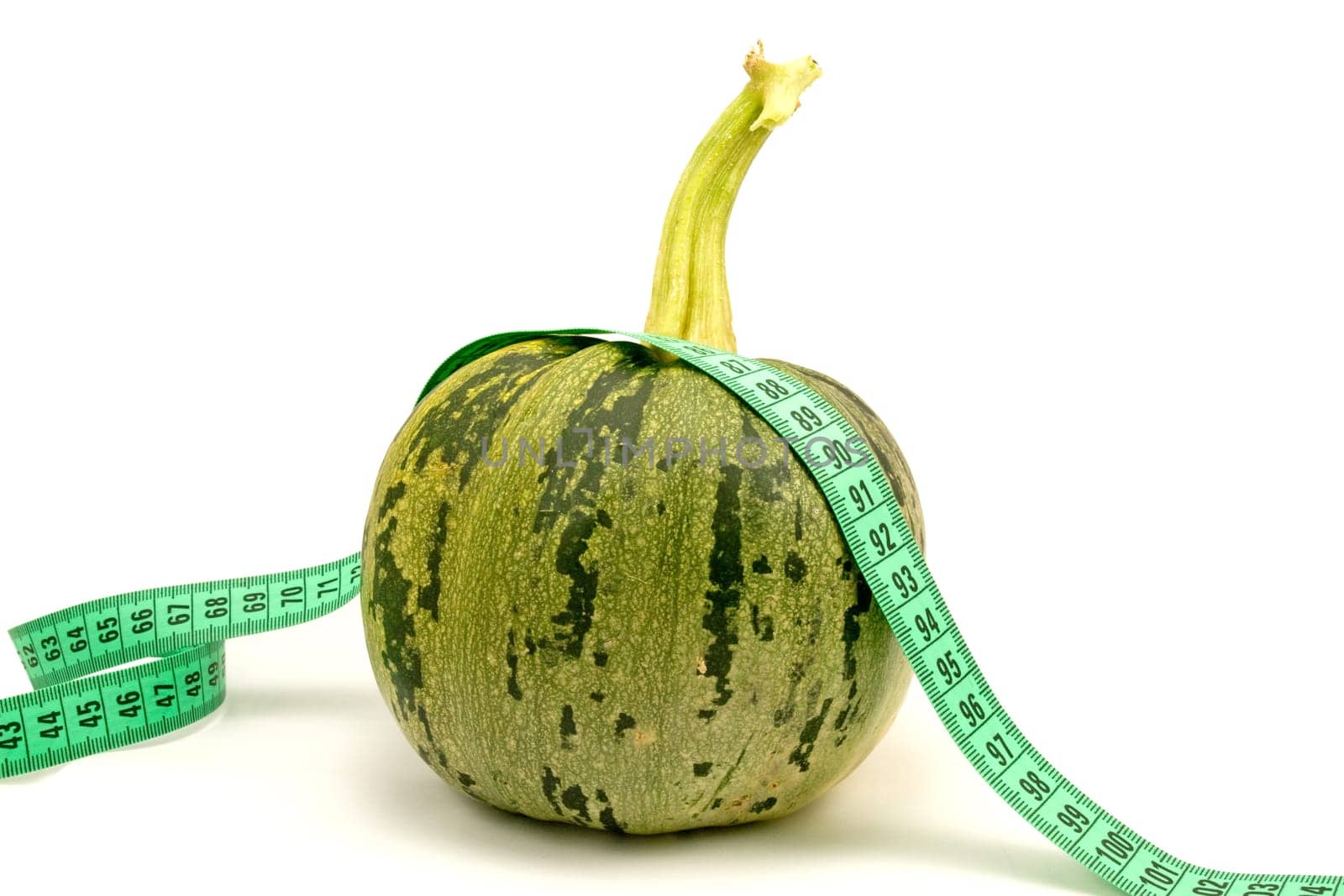 diet and nutrition. zucchini with measuring tape