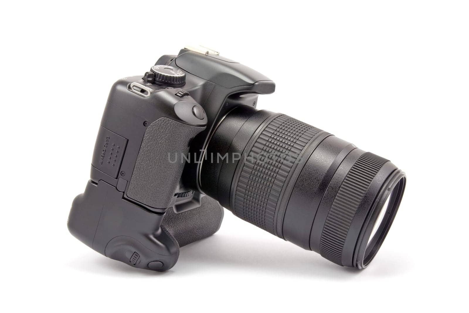 photo camera with battery grip and lens