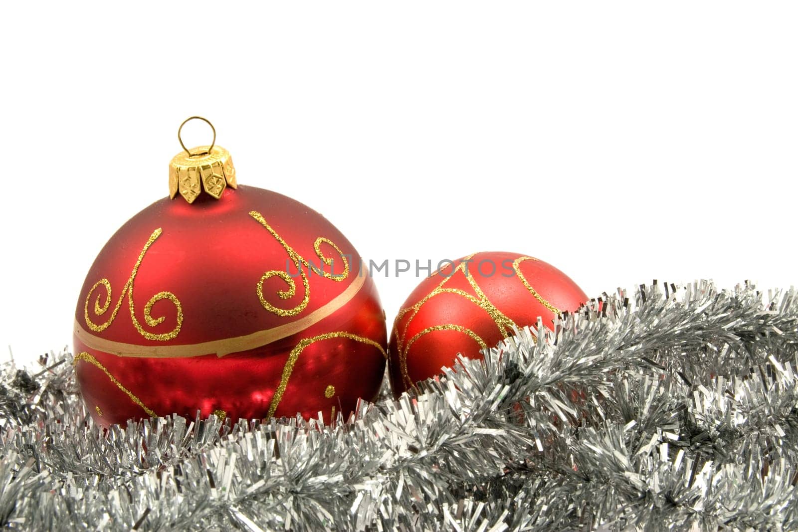 garland with christmas baubles over a white background