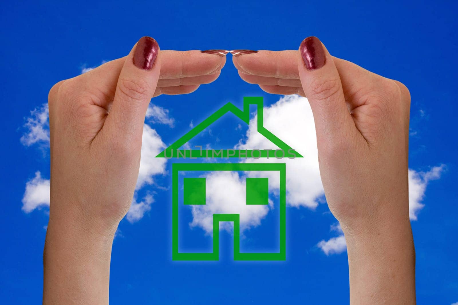hands and icon house over a sky background