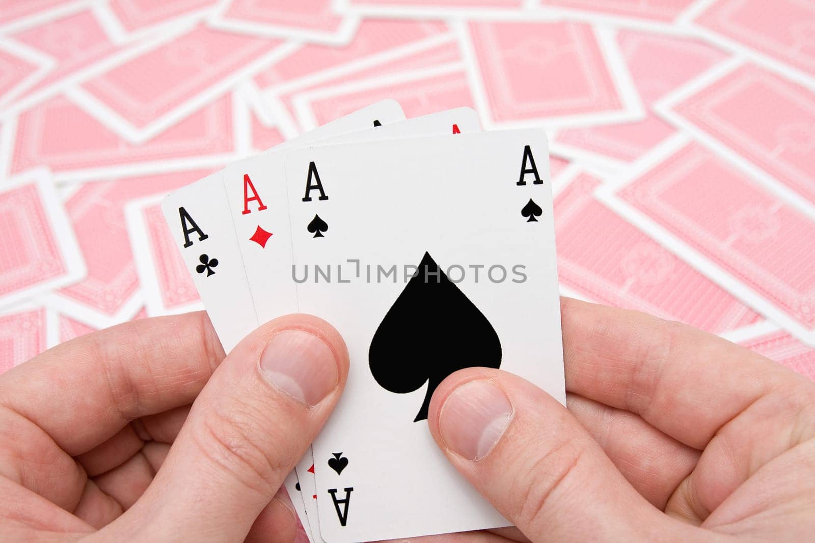 concept for gamble . hands with three aces.