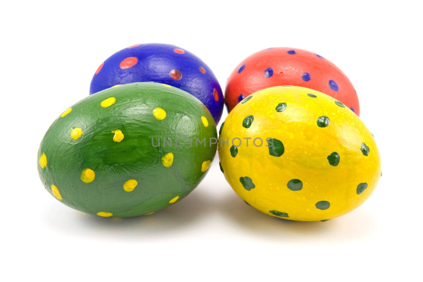 four colorful easter eggs on white background
