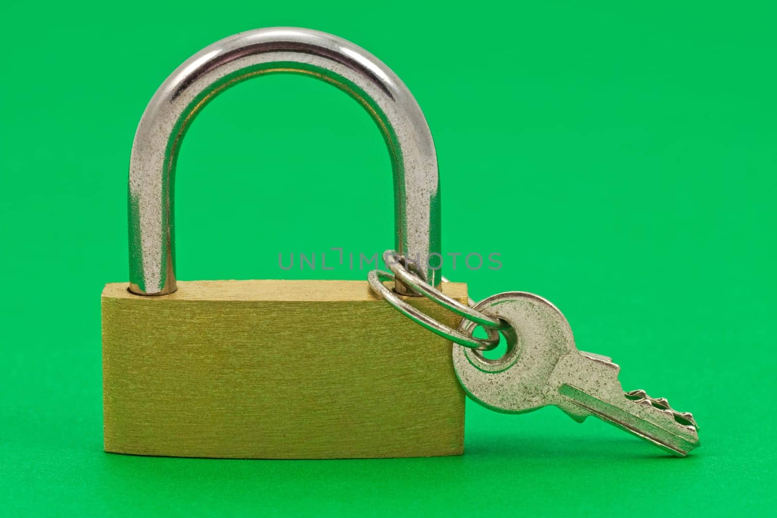 padlock with keys, isolated on green background