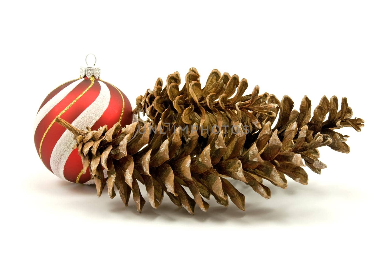 pine cones and christmas bauble on white background