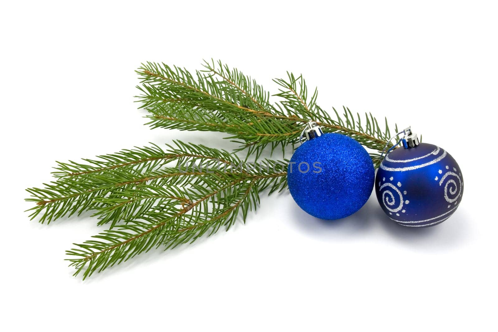 fir branch with christmas baubles. isolated on white