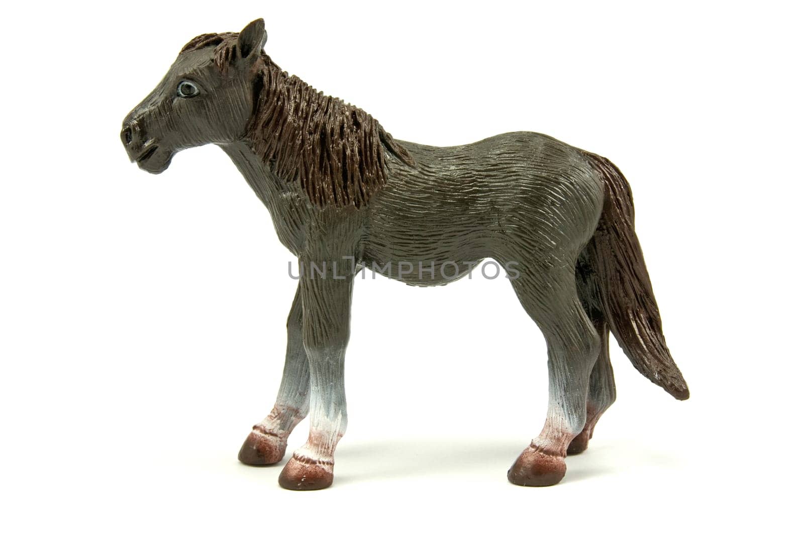 brown plastic horse isolated on white background