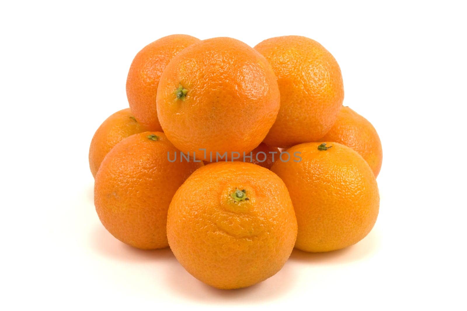pile of fresh tangerines on white background