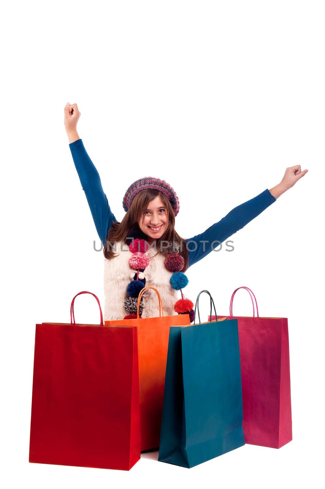 Beautiful young girl posing with shopping bags isolated in white
