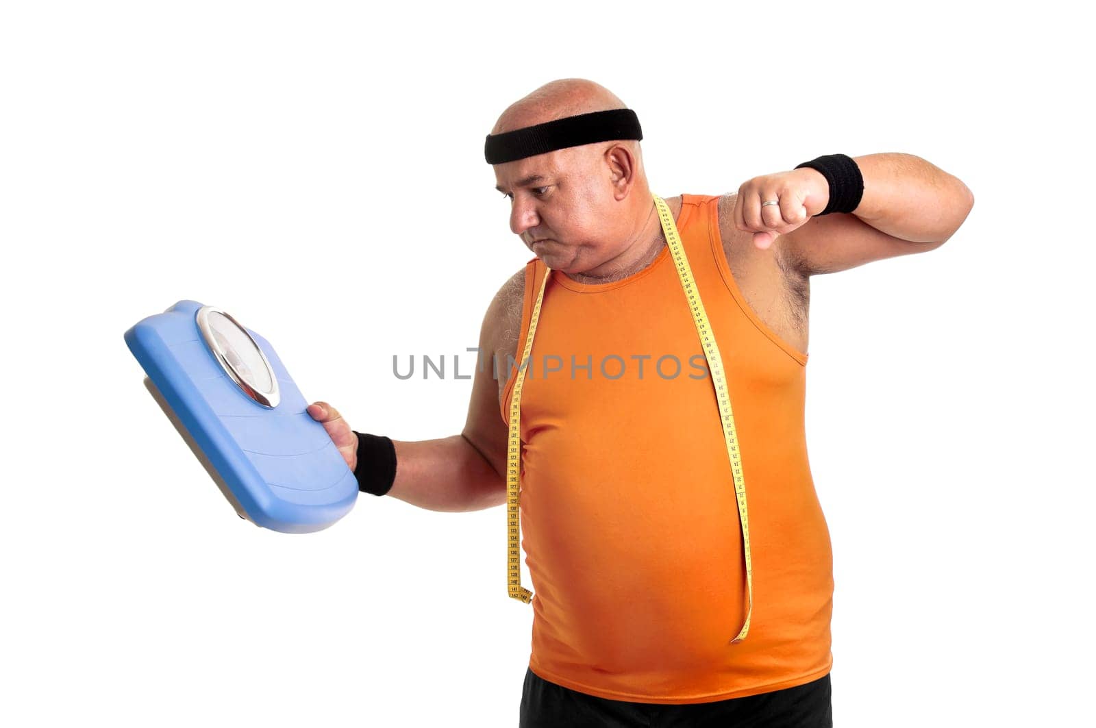 Large fitness man angry with weight scale isolated in white