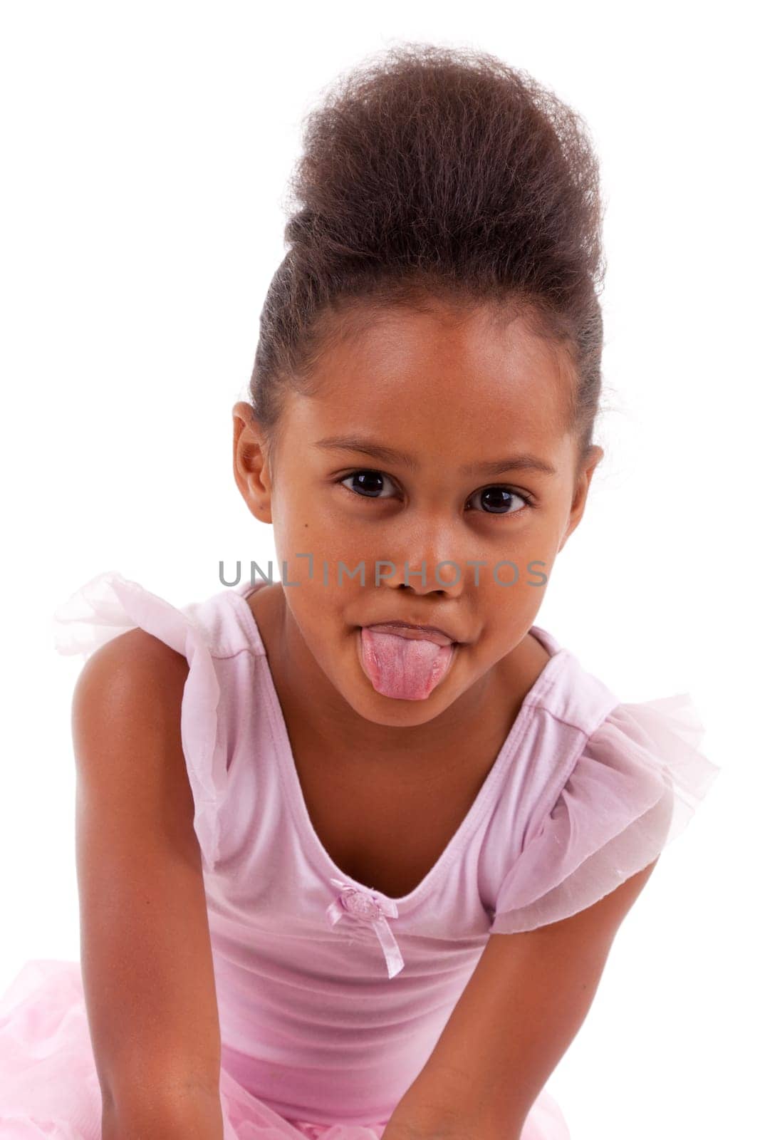Cute little African Asian girl sticking tongue out, isolated on white background